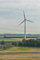 Windmill as wind turbine power generator in the Netherlands photo