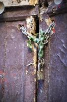 door of an abandoned building with a lock photo