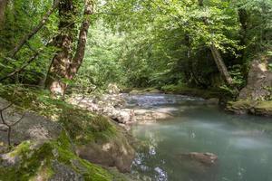 black river that comes from the marmore waterfalls photo