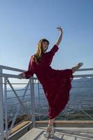 long haired girl dancing outdoors photo