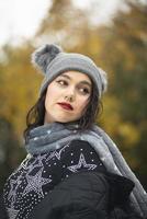 brunette girl in winter clothing mountain location photo