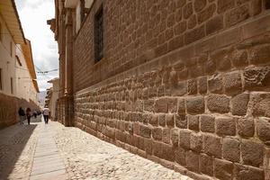 People walking on the street in Cusco, Peru photo