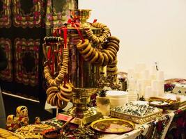 Russian samovar with steering-wheel and tea photo