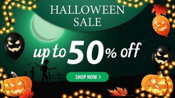 Halloween sale, green horizontal discount banner with halloween green landscape on background, halloween balloons, garland and pumpkins. Discount banner with up to 50 off vector