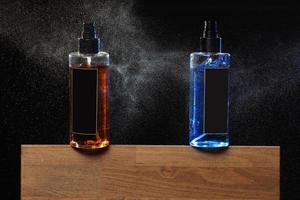 Two spray bottles for hair, barber shop concept photo