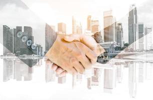 Handshake with cityscape background photo