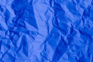 Crumpled blue paper, great background for web pages, collages, layouts photo