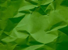 Crumpled green paper, great background for web pages, collages, layouts photo