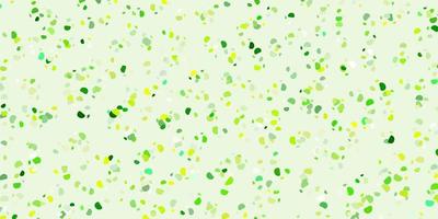 Light green, yellow vector backdrop with chaotic shapes.