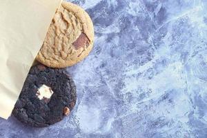 close up of sweet cookies on black background photo