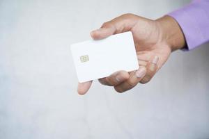 close up of person hand holding credit card photo