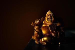 Statue of laughing Buddha photo