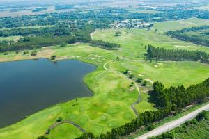 High angle golf course with nature background photo