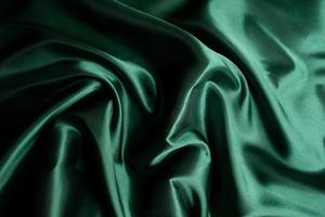 Green fabric texture background, abstract, closeup texture of cloth photo