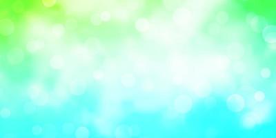 Light Blue, Green vector backdrop with dots. Glitter abstract illustration with colorful drops. New template for a brand book.