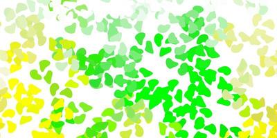 Light green, yellow vector backdrop with chaotic shapes.