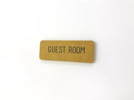 Yellow sign on the white door. Guest room photo