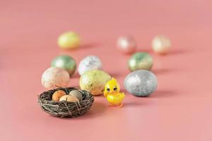 Easter eggs in a natural nest with bird eggs photo