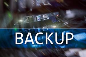 Backup button on modern server room background. Data loss prevention. System recovery. photo