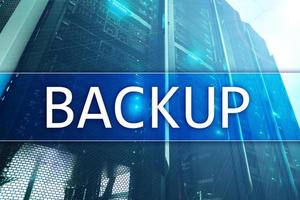 Backup button on modern server room background. Data loss prevention. System recovery. photo