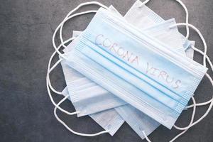 Close up of blue surgical masks on table photo