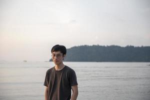 A man thoughtful   on beach photo