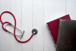 Concept of medical education with book and stethoscope photo