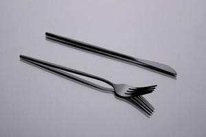 Cutlery on a gray background with shadow. Table serving photo