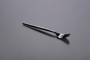 Cutlery on a gray background with shadow. Table serving photo