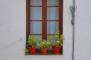 Spanish window on the facade of the house photo