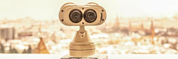 Coin-operated binoculars on the observation deck overlooking the city photo