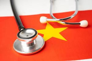 Stethoscope on China flag, check problem of business and finance concept. photo