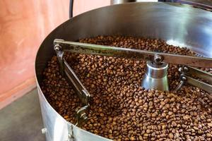 Coffee beans in coffee roasting machines photo