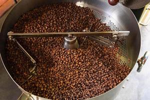 Coffee beans in coffee roasting machines photo