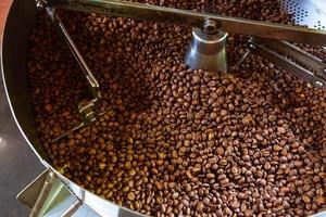 Coffee beans in coffee roasting machines photo