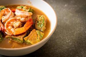 Sour soup made of Tamarind Paste with Shrimps and Vegetable Omelet photo