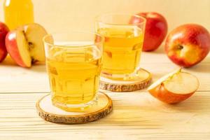 Apple juice with red apples fruits photo