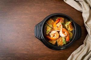 Sour soup made of Tamarind Paste with Shrimps and Vegetable Omelet photo