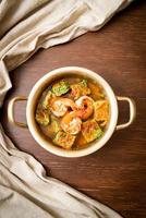 Sour soup made of Tamarind Paste with Shrimps and Vegetable Omelet photo