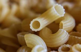Variety of types and shapes of dry Italian pasta photo
