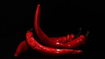 Red hot chili peppers on a black background photo