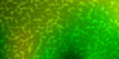 Light green, yellow vector background with hexagonal shapes.