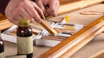 Restoration of wooden doors, windows with wax pencil photo