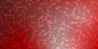 Light red vector backdrop with a batch of hexagons.