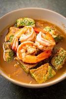 Sour soup made of Tamarind Paste with Shrimps and Vegetable Omelet photo