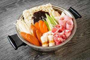 Budae Jjigae or Budaejjigae or Army stew or Army base stew. It is loaded with Kimchi, spam, sausages, ramen noodles and much more photo