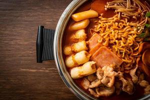 Budae Jjigae or Budaejjigae or Army stew or Army base stew. It is loaded with Kimchi, spam, sausages, ramen noodles and much more photo