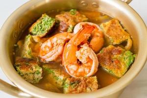 Sour soup made of Tamarind Paste with Shrimps and Vegetable Omelet photo