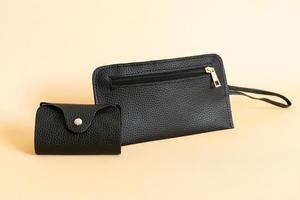 Black leather handbag and black leather card bag photo