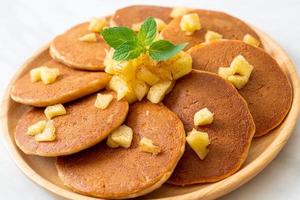 Apple pancake or apple crepe with cinnamon powder photo